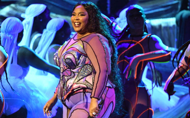 Lizzo Rolls Around In The ‘Middle Of The Ocean’ In A Blue Tie-Dye Bikini